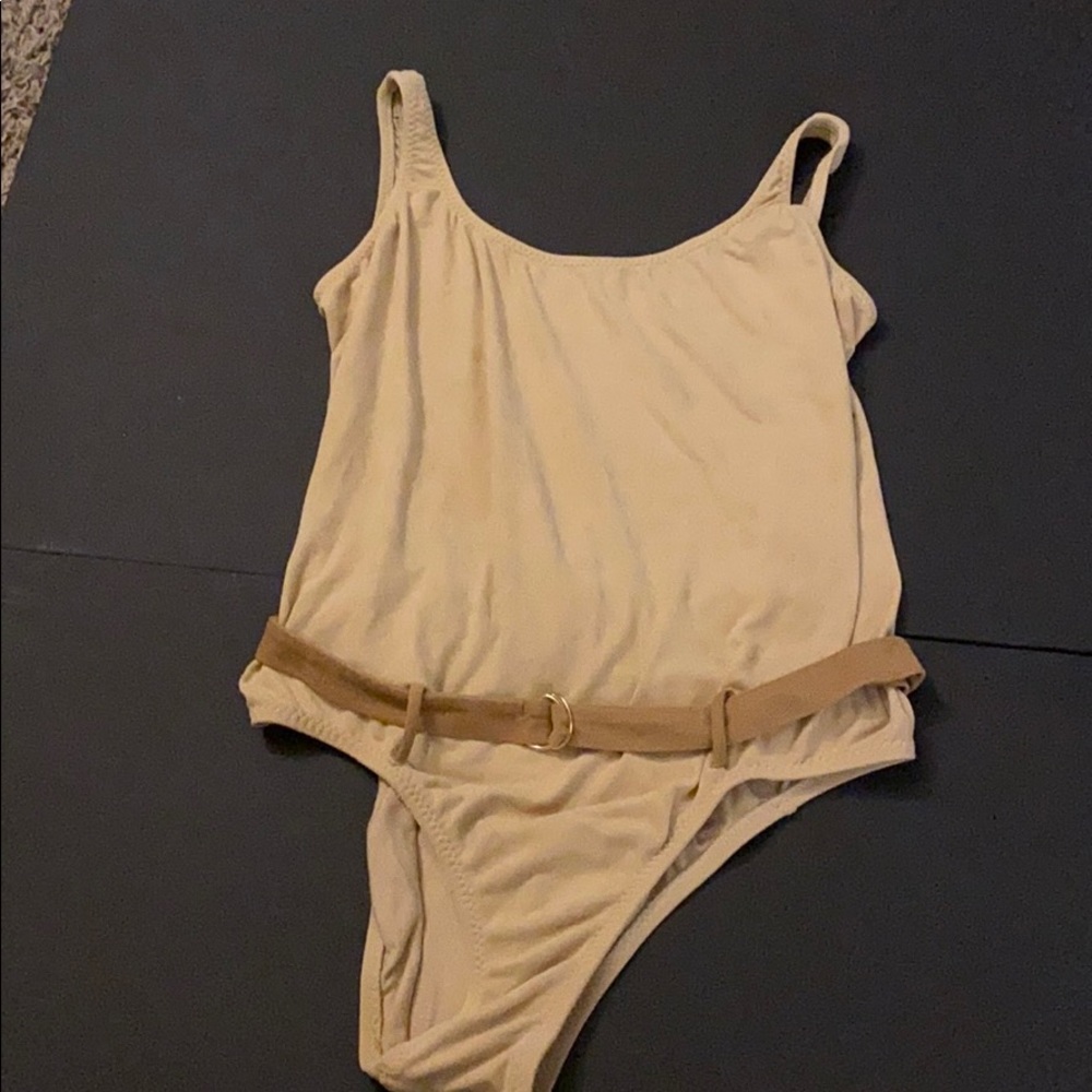 Body suit with a belt